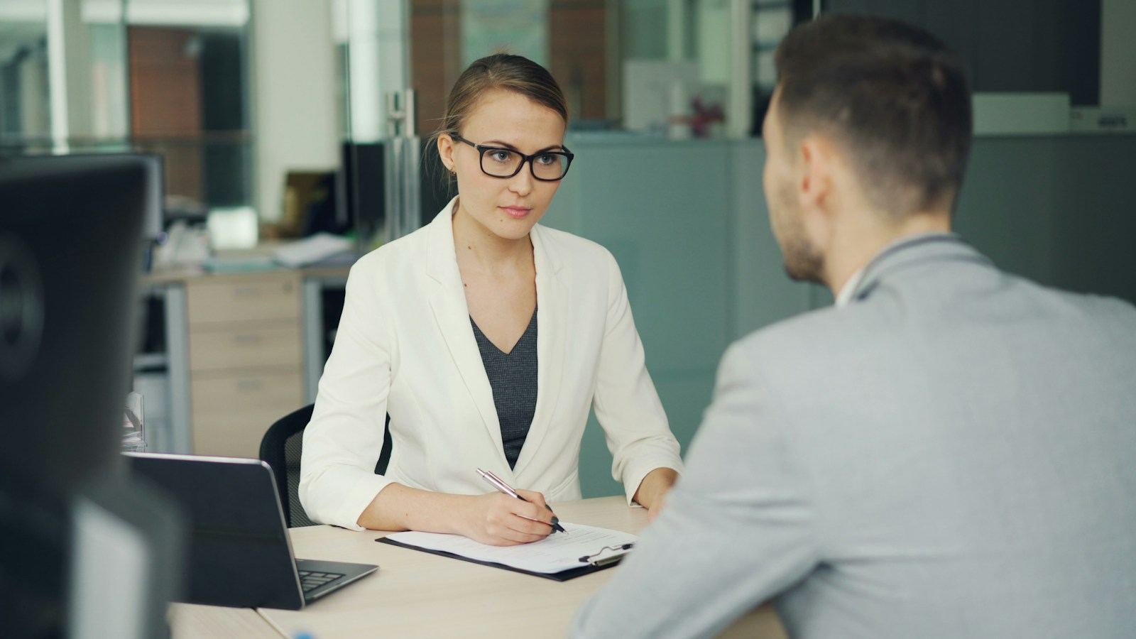 A recruiter interviewing a candidate