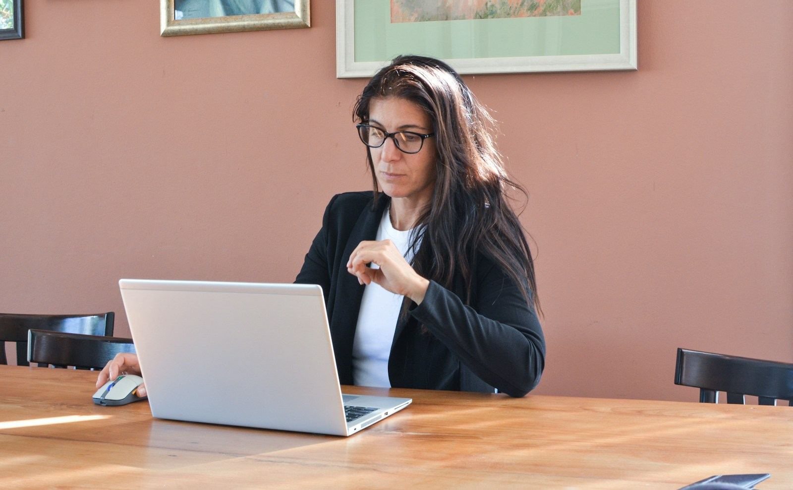 A recruiter reviewing candidates on a laptop